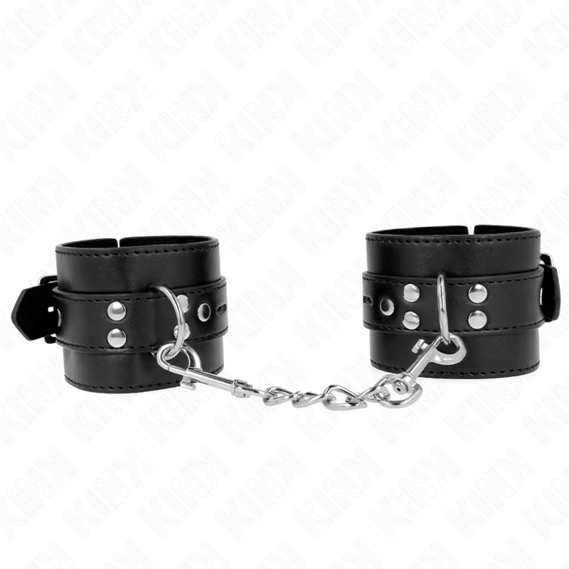 Imagen que nos facilita KINK WRIST RESTRAINT de su producto erótico KINK - MUÑEQUERAS NEGRO CON CORREA NEGRO AJUSTABLE 17-28 CM X 6 CM para nuestra categoría "BDSM & BONDAGE |Bondage|Esposas de fijación".